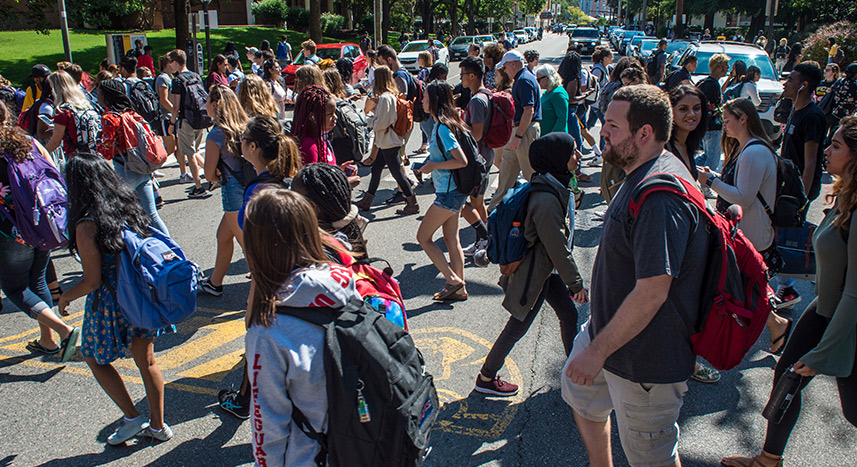 Students crossing street on campus