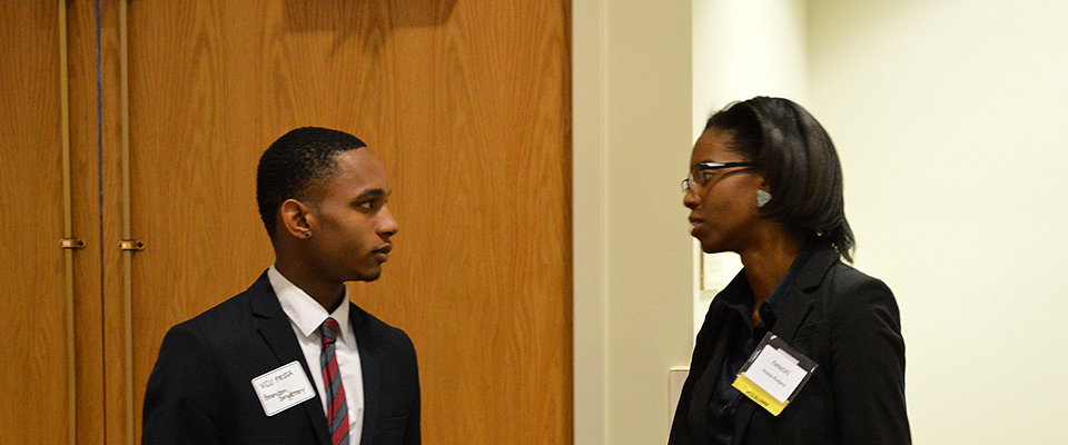 A student speaks with a mentor.